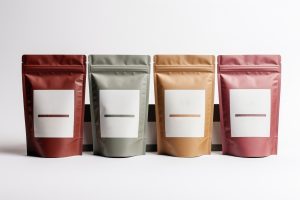 Four blank labeled packaging pouches in various colors